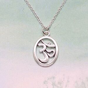 Buddhist OM in Oval Silver Necklace